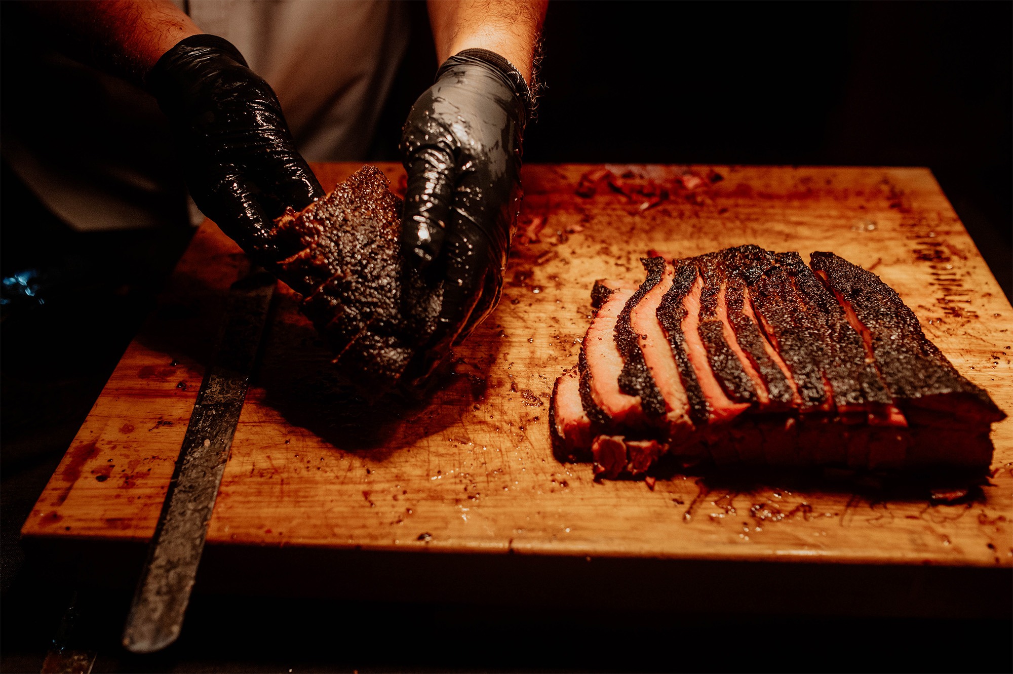 Man slicing beef